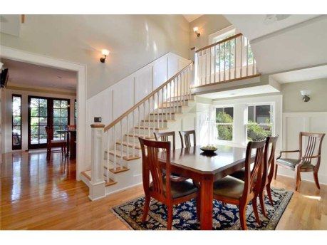 Dining Room with elegant stairway to new second fl