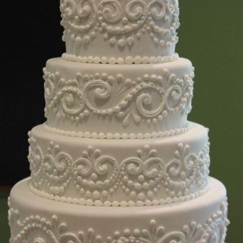 4 tiered wedding white cake with fruit and cream f