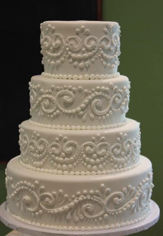 4 tiered wedding white cake with fruit and cream f