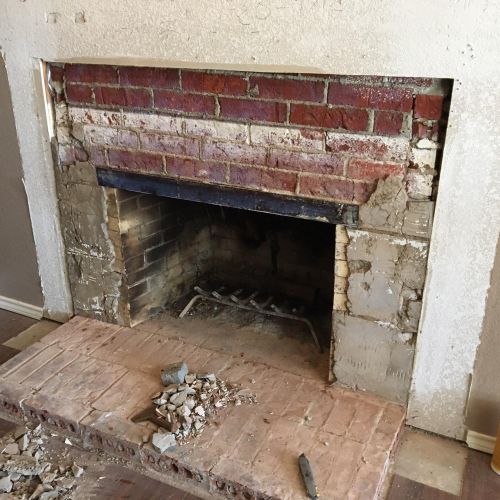 Before photo of fireplace renovation.