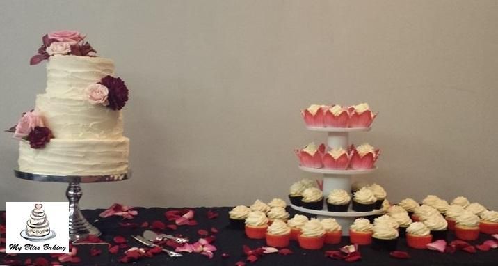 Rustic wedding cake and cupcakes