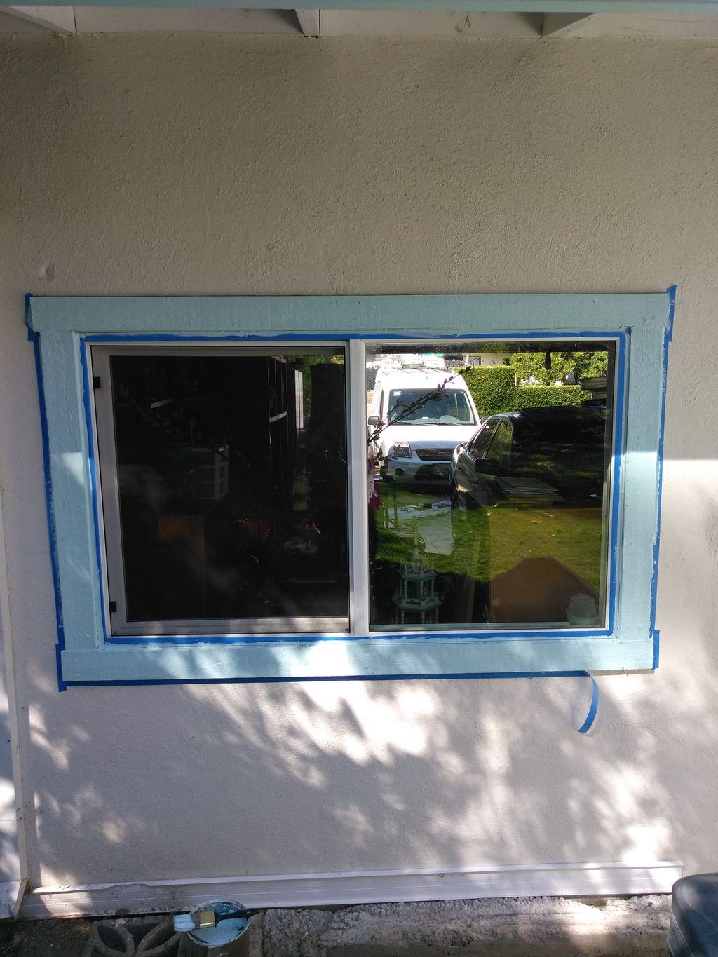taped off re-sealed window and painted