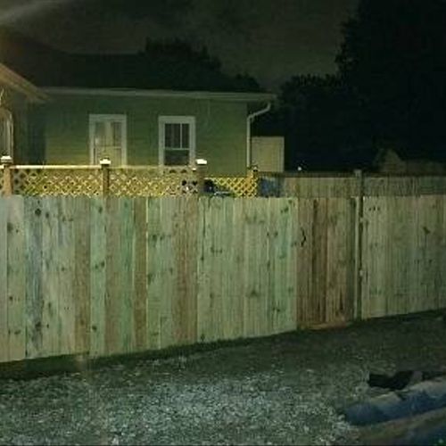 Treated fence around back yard.