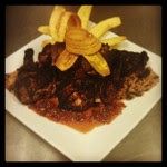 Jerk Chicken, red beans and rice, fried plantains,