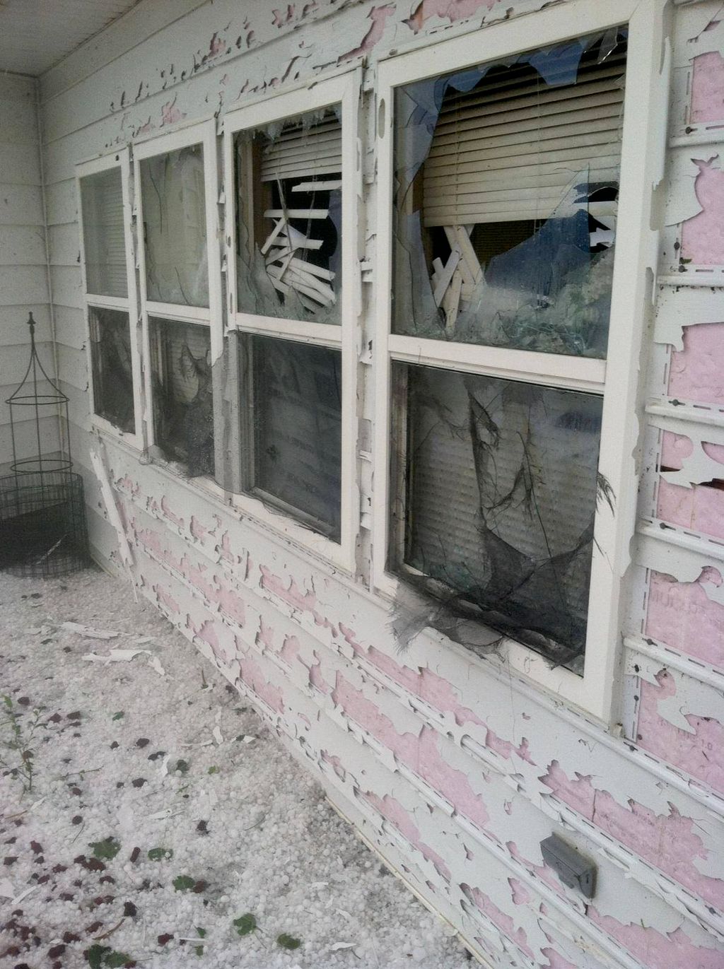 Damage caused by hail can include broken windows a