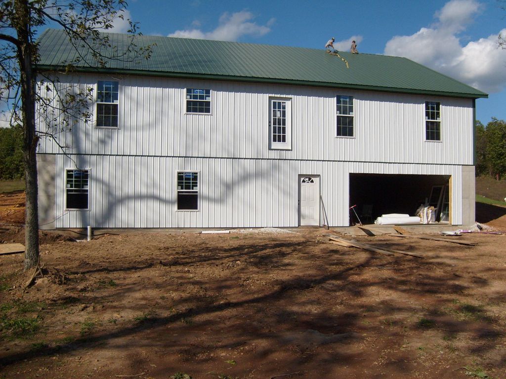 Installing metal siding to new home