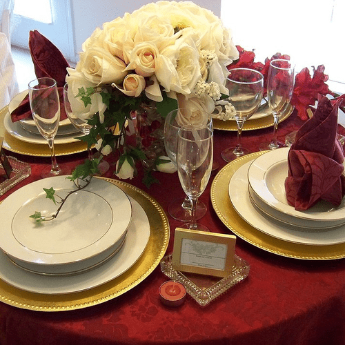 Private dinner, burgundy, ivory and gold color sch