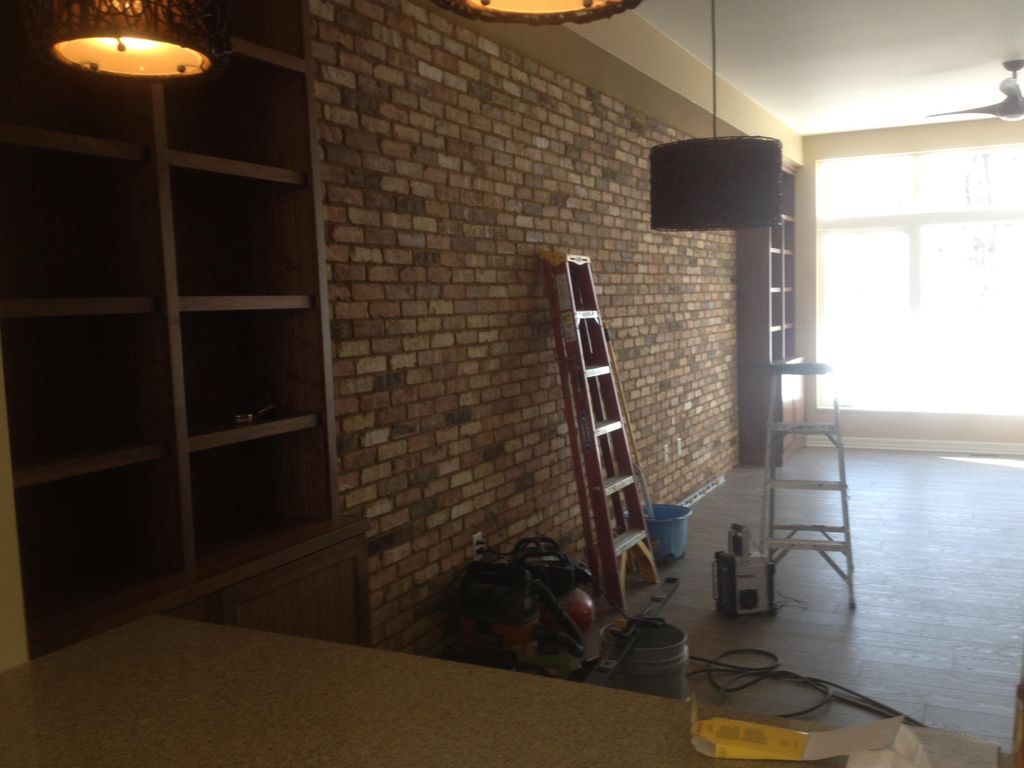 Brick tiles and built in custom cabinets