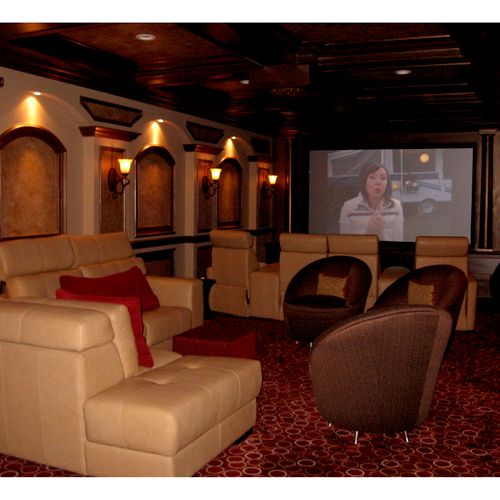 A beautiful home theater with a coffered ceiling, 