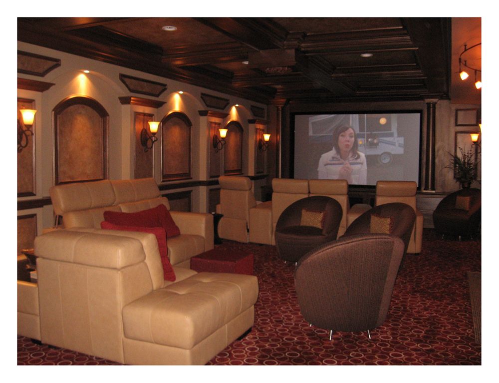 A beautiful home theater with a coffered ceiling, 