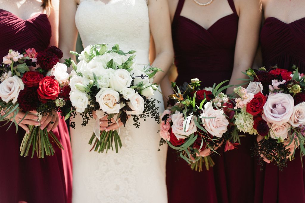 Maids bouquets of burgundy dahlias, blush dahlias,