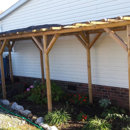 A rustic styled pergola custom built to shade the 