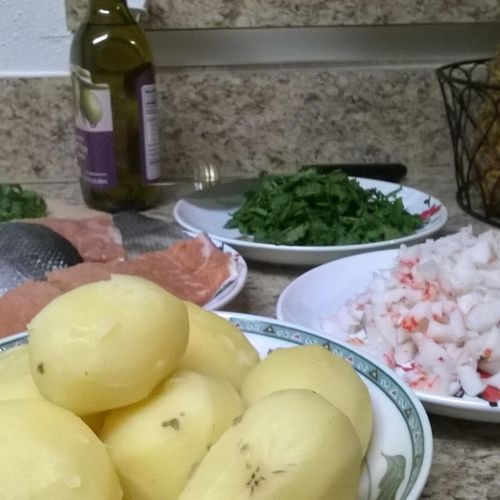 in prep, charred salmon over crab potato salad