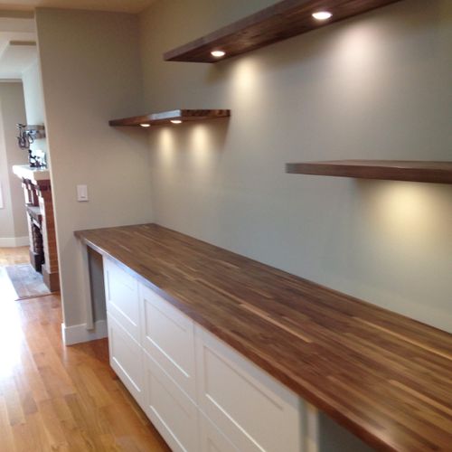 Cabinets with chopping block style countertop. Als