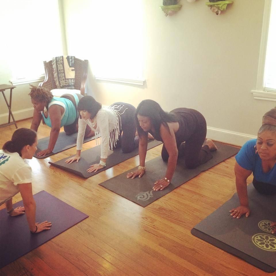 Leading a hatha yoga class at a Houston studio.