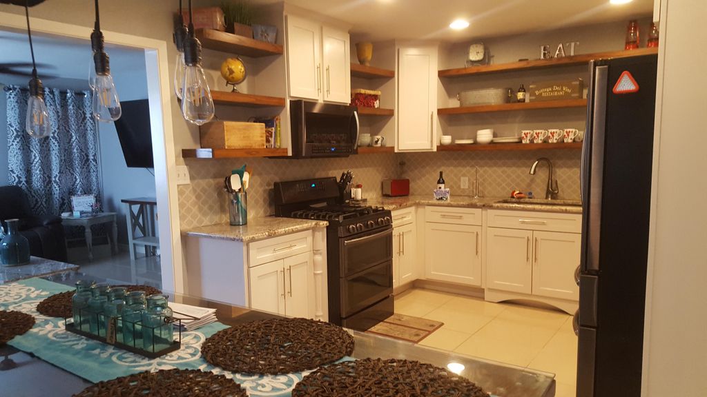 kitchen remodel with open  oak shelving, painted s