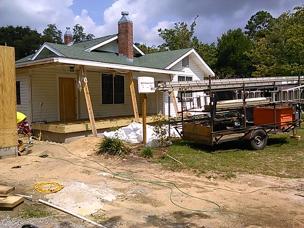 house on 12th Ave with porch roof and house suppor