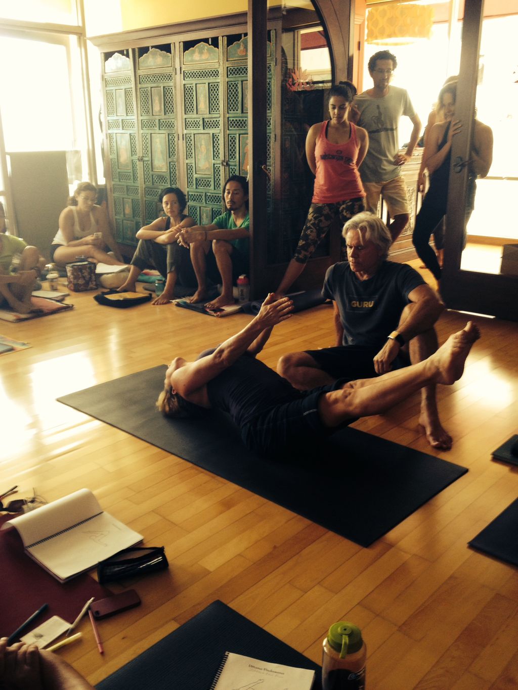 demonstrating a posture during teacher training