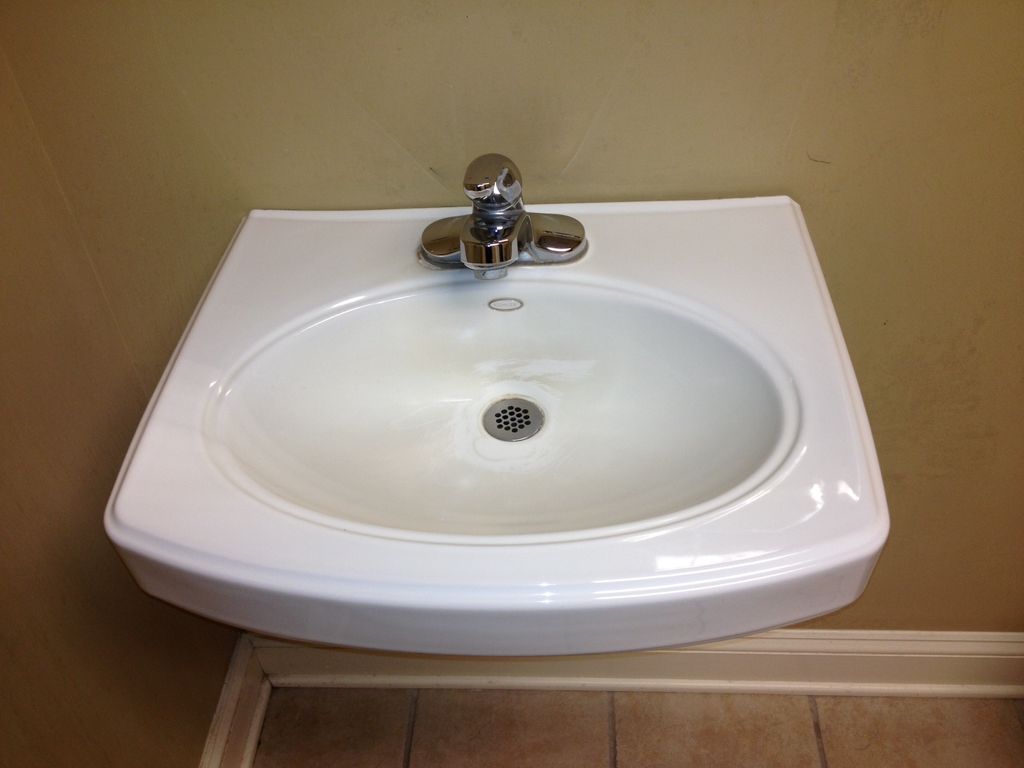 A stain from coffee dumping turns the sink brown