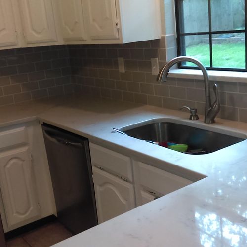 After: Subway tile and quartz counter tops