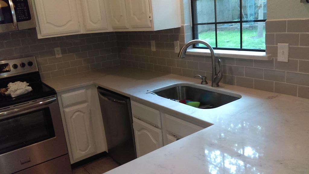After: Subway tile and quartz counter tops