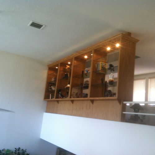 Oak display cabinets with glass shelving separatin