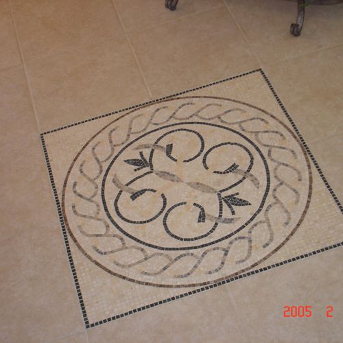 Custom tile inlay in foyer