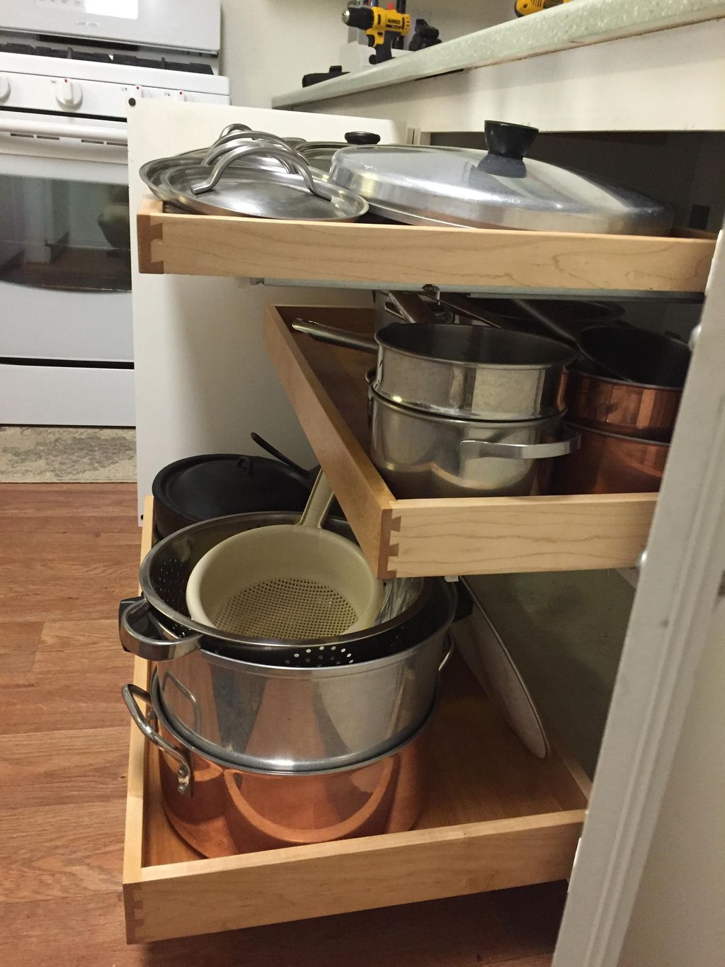 pull out maple shelves showing dove tailed joinery