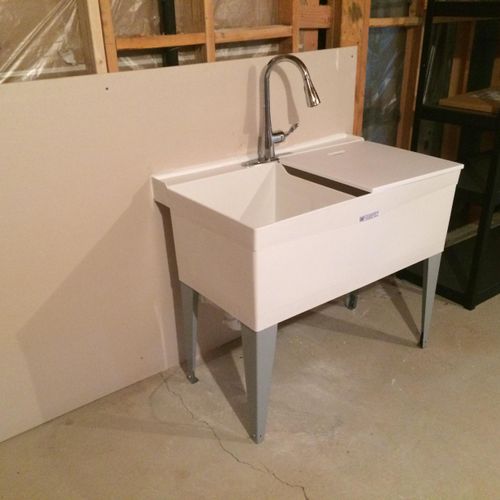 add a laundry sink in the basement or garage