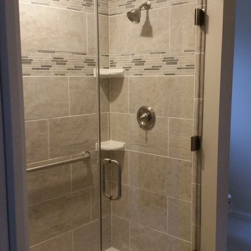 custom tile shower with frame-less glass doors