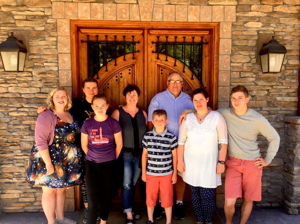 Julie in Center surround by family