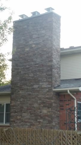 Covered entire chimney with cultured stone.