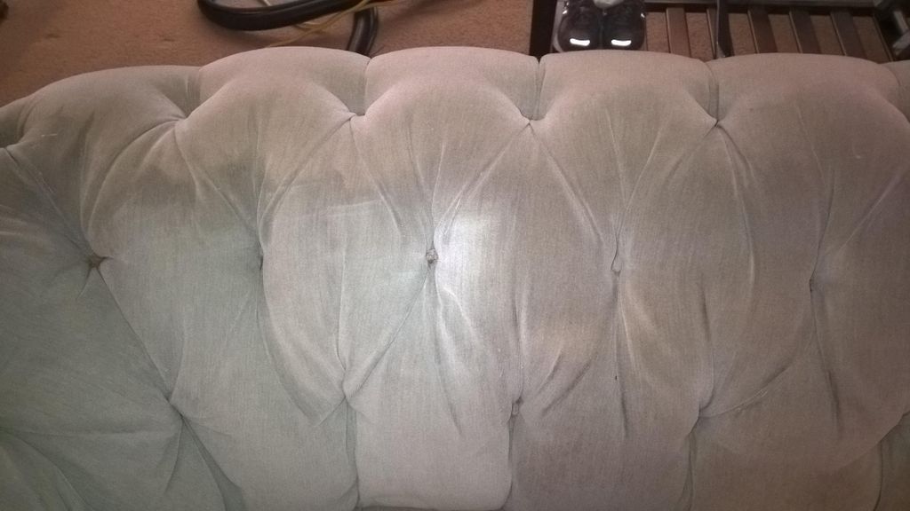 Bottom left hand corner of the couch is clean and 