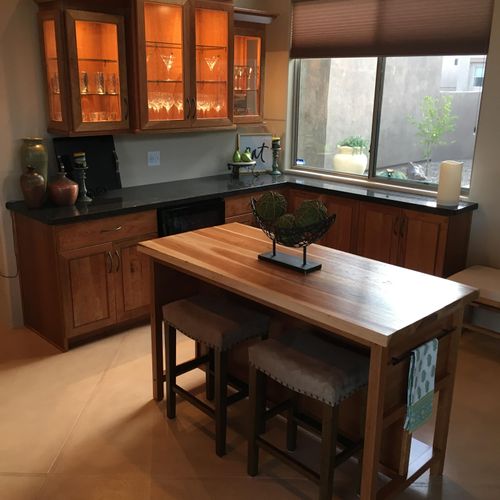 Cherry cabinets with lighted wall cabinets. Solid 