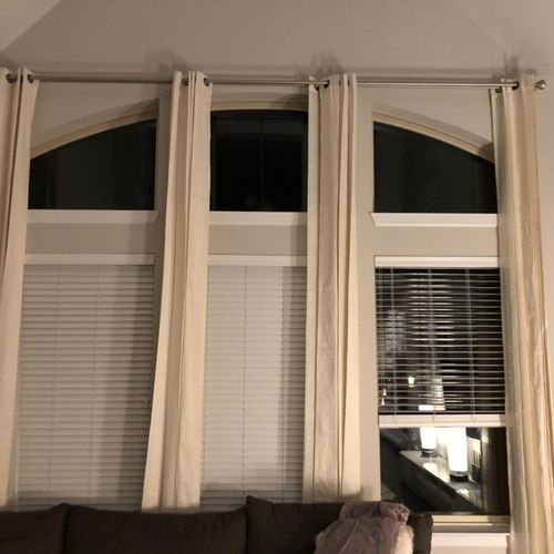 Installed curtain rod and 120”+ tall curtains.