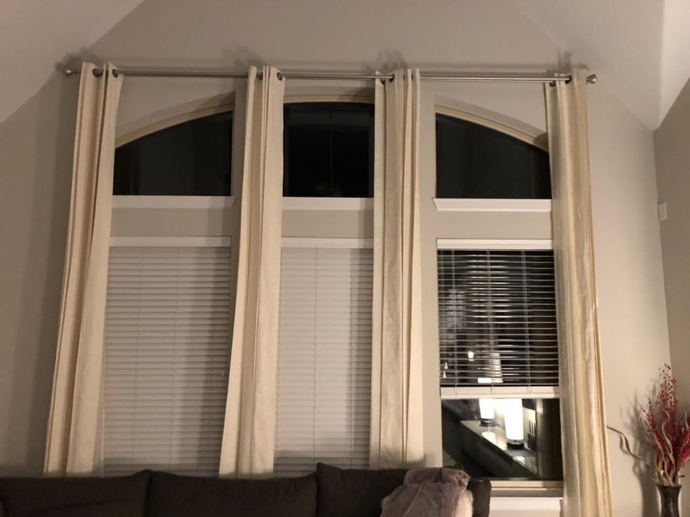 Installed curtain rod and 120”+ tall curtains.