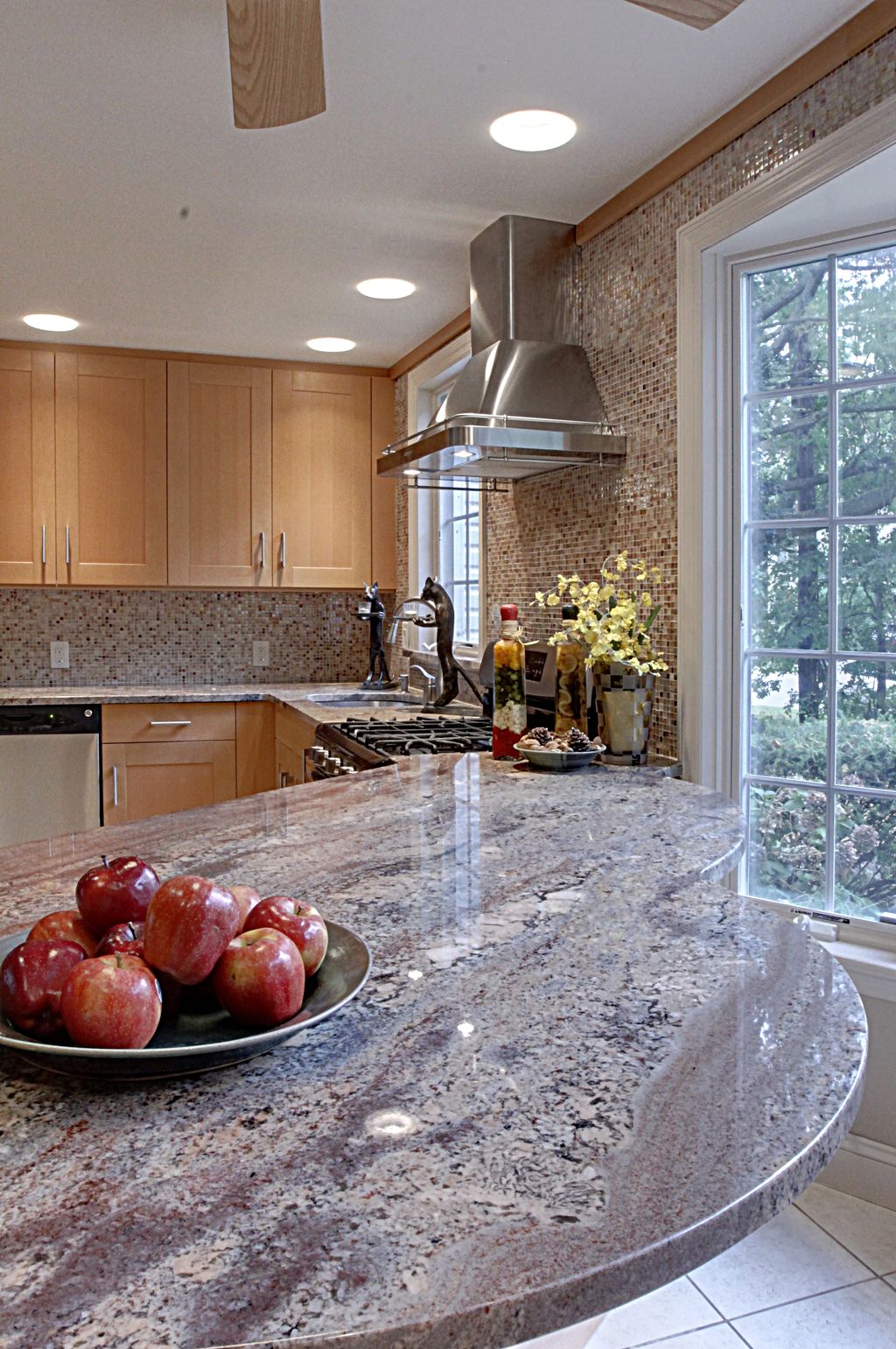 Kitchen renovation,  featuring mosaic iridescent g