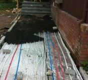 Putting a heating system under the walkway in West