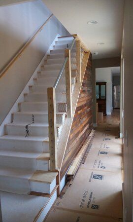 installed cable handrail and wood trim