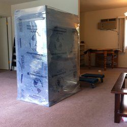 A big Cabinet wrapped by "My Professional Movers"