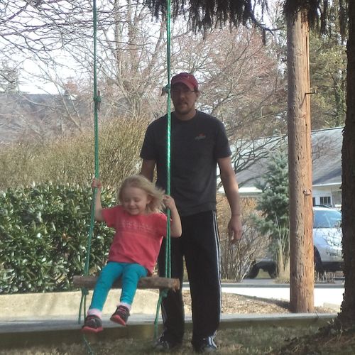 Daughter Keira being encouraged to swing and enjoy