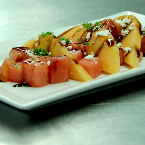 Melons w/crumbled goat cheese and balsamic reducti