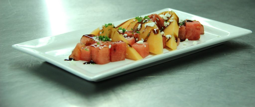 Melons w/crumbled goat cheese and balsamic reducti