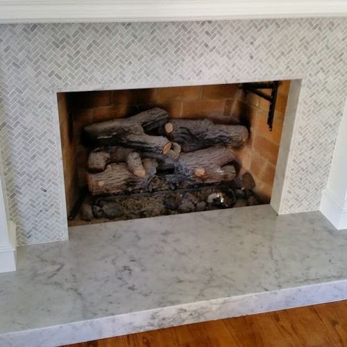 fireplace hart made out of white carrera.sorround 
