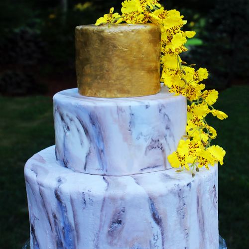 Hand painted wedding cake with gumpaste yellow orc