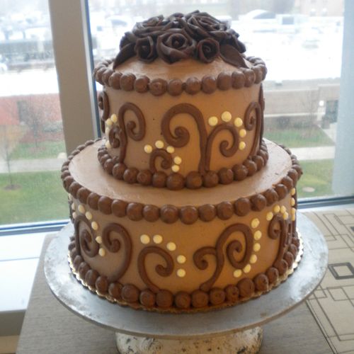 An all chocolate cake with handmade chocolate flow