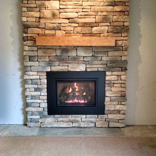 Complete makeover, new mantle, stone, gas fireplac
