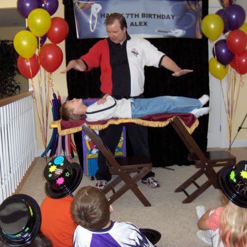Eddy Wade professional magician Floating a child a