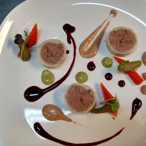 Duck Torchon with pickled vegetables, cranberry mu