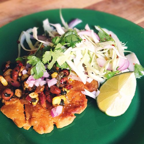 Vegan arepas with roasted corn salsa and lime, cil